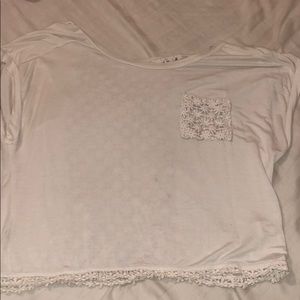 White top with floral designed lace and open back